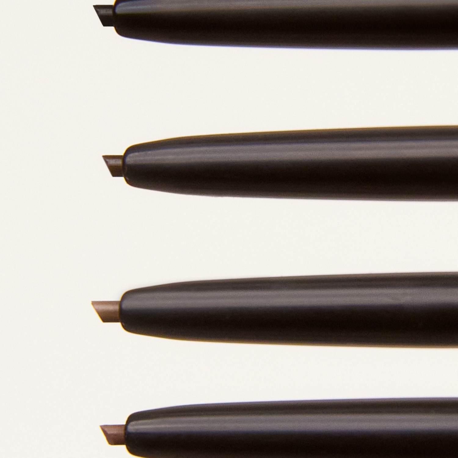 Four pencils on a white background