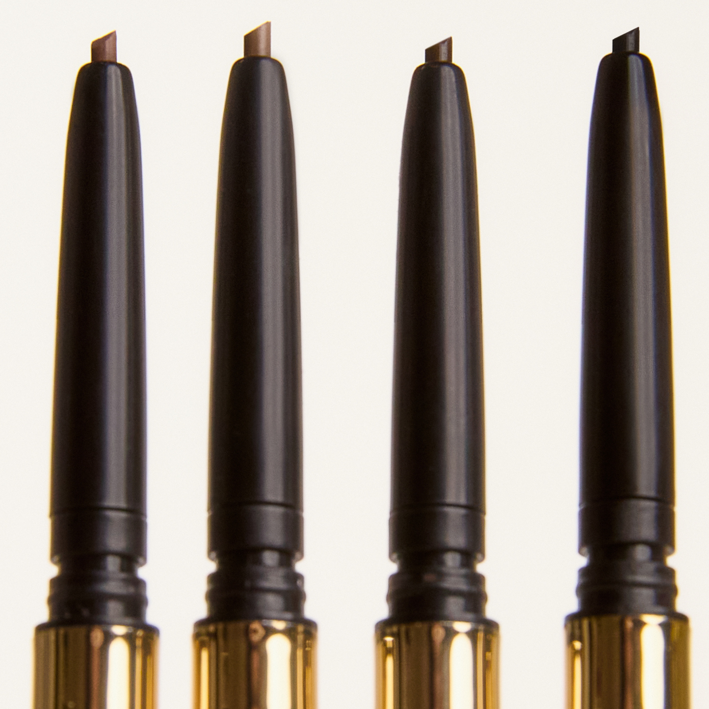 Four pencils on a white background