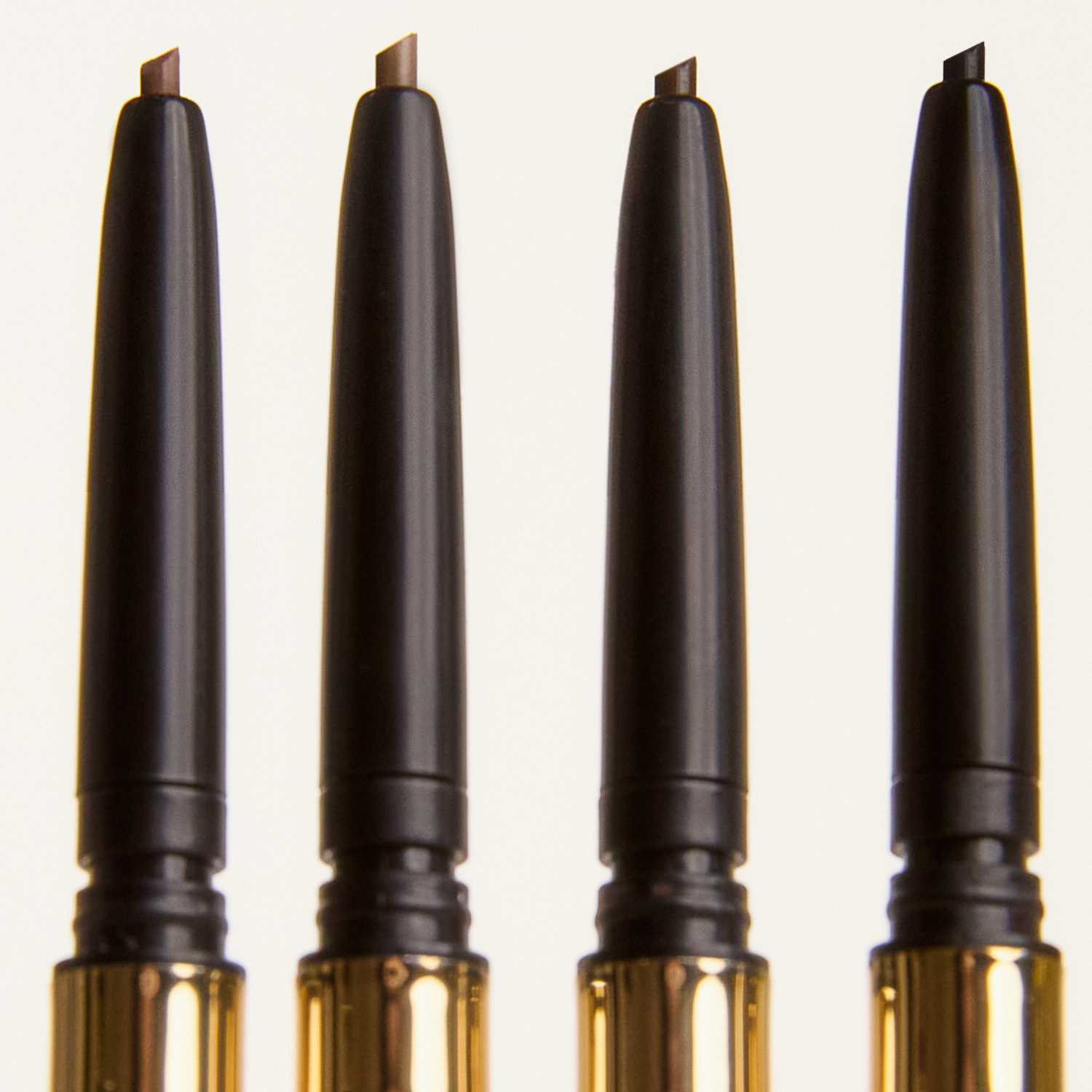 Four pencils on a white background