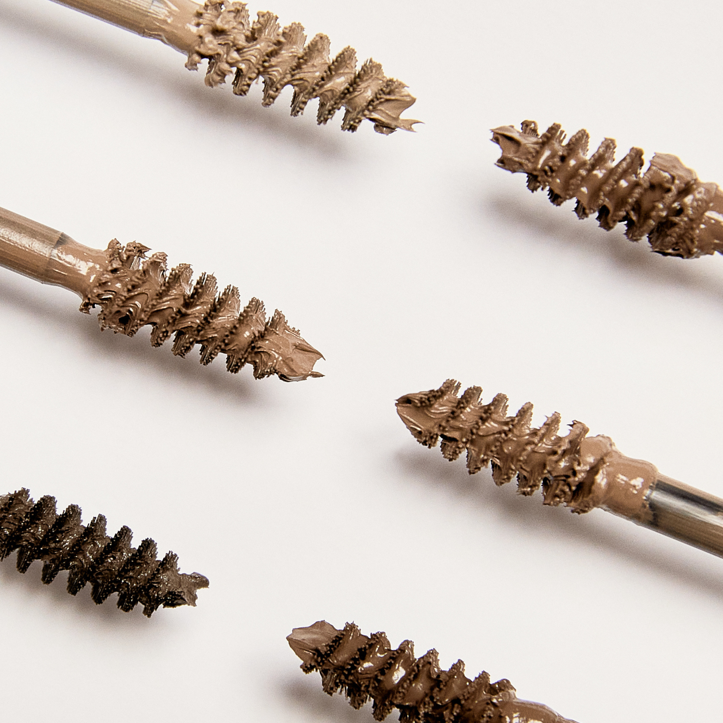 Close up shot of spoolies with Tinted Multi-Peptide Brow Gel 